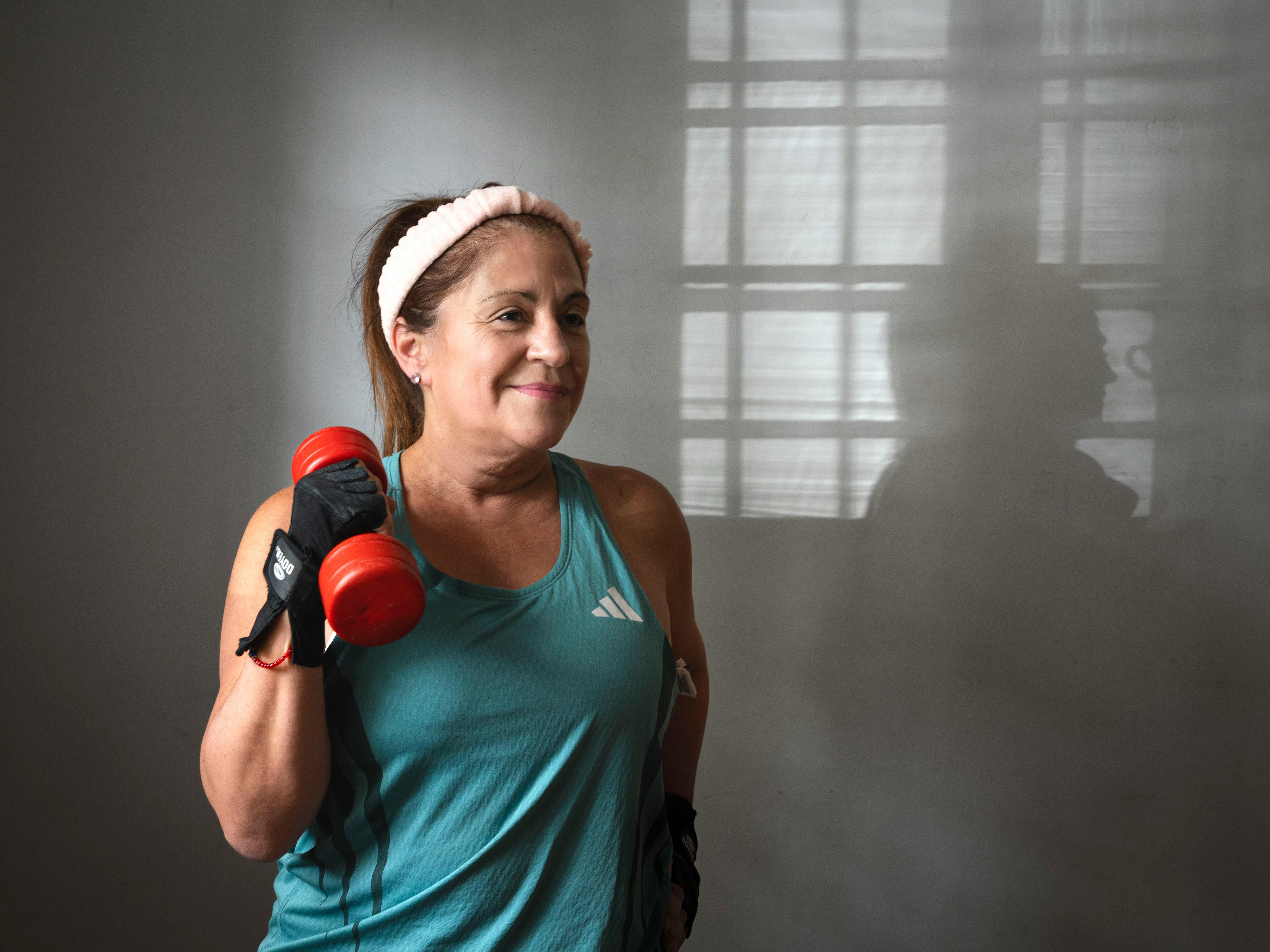 Senior woman exercising with dumbbells in a strength training session
