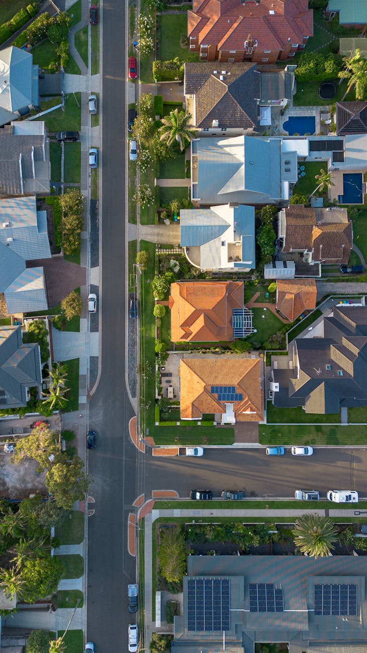 Aerial view of suburban rooftops in Collaroy, NSW, with colourful tiled roofs and pockets of green