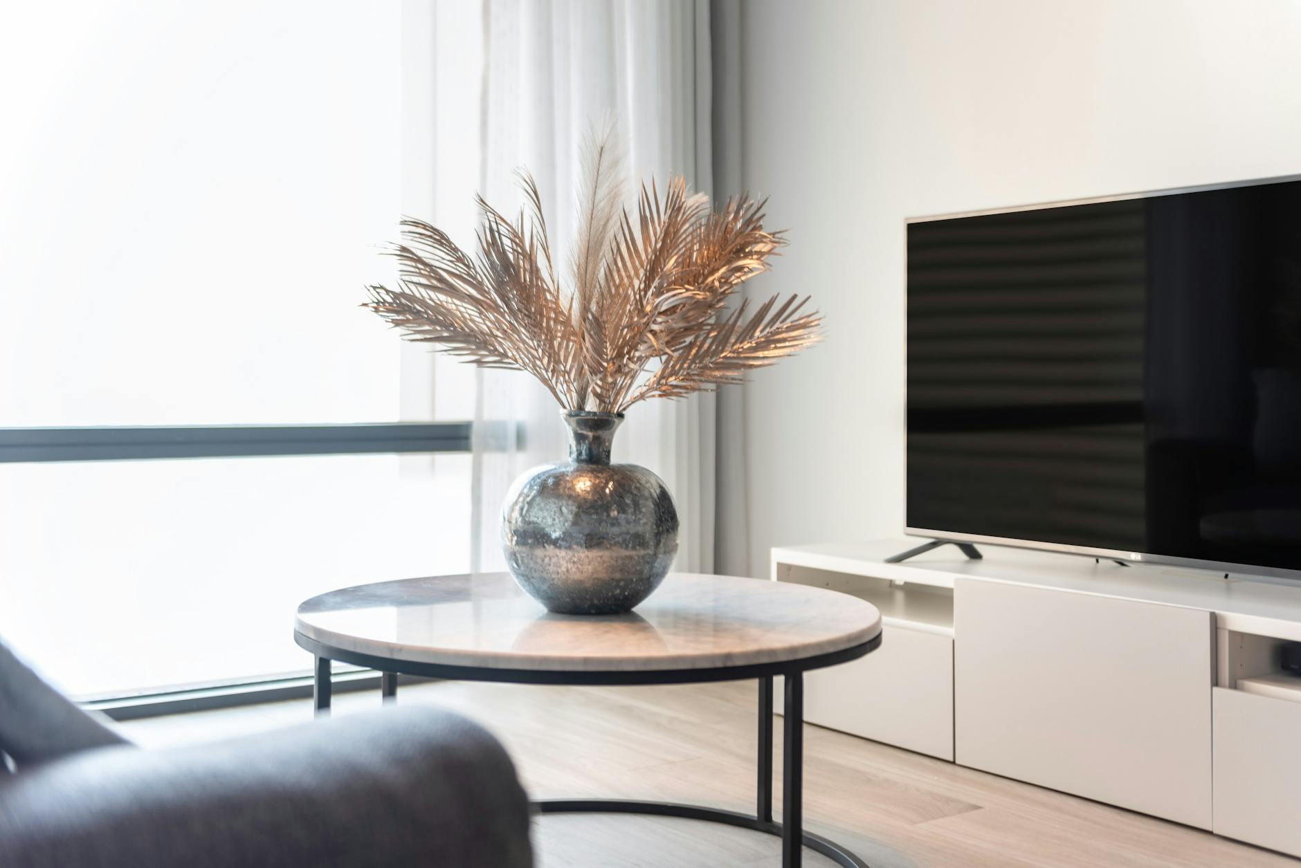 A neutral, styled living room with soft light