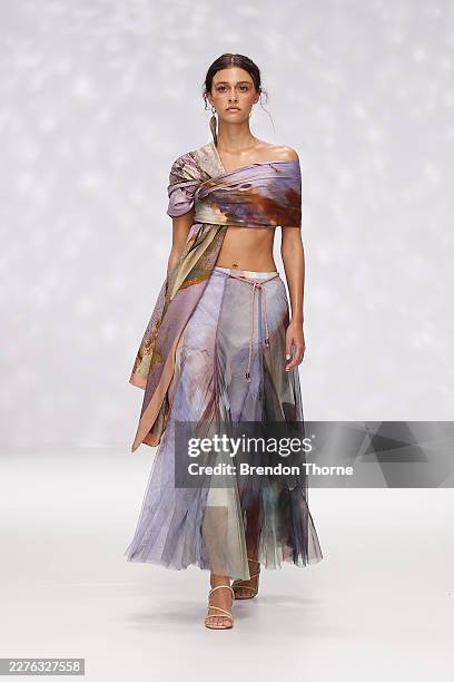 A model walks the runway during the Ngali show at Australian Fashion Week