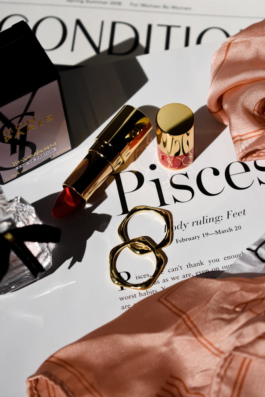 Beauty products arranged in warm light to illustrate the Marc Jacobs Beauty relaunch feature.