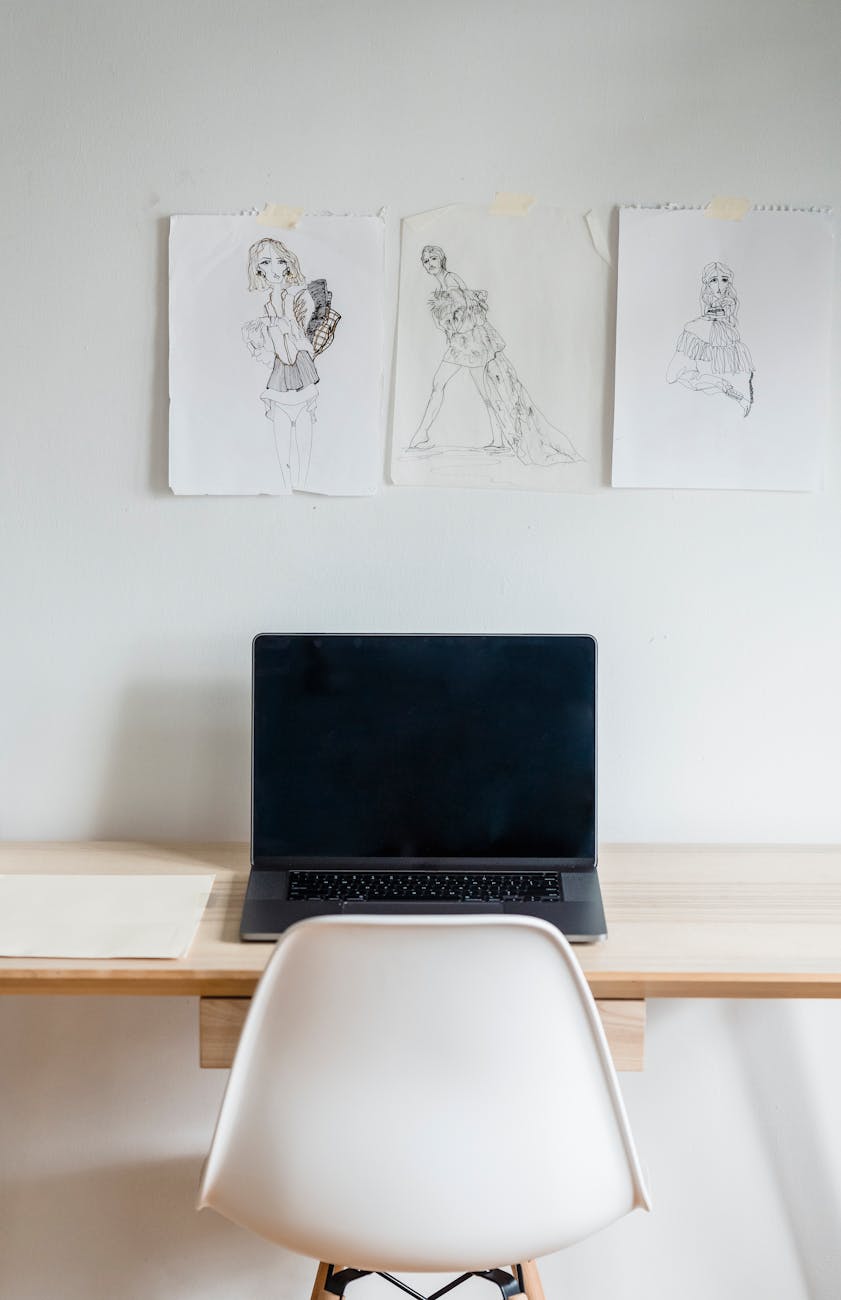 Fashion sketches and a laptop in a studio where ideas can be copied faster than they can be protected.