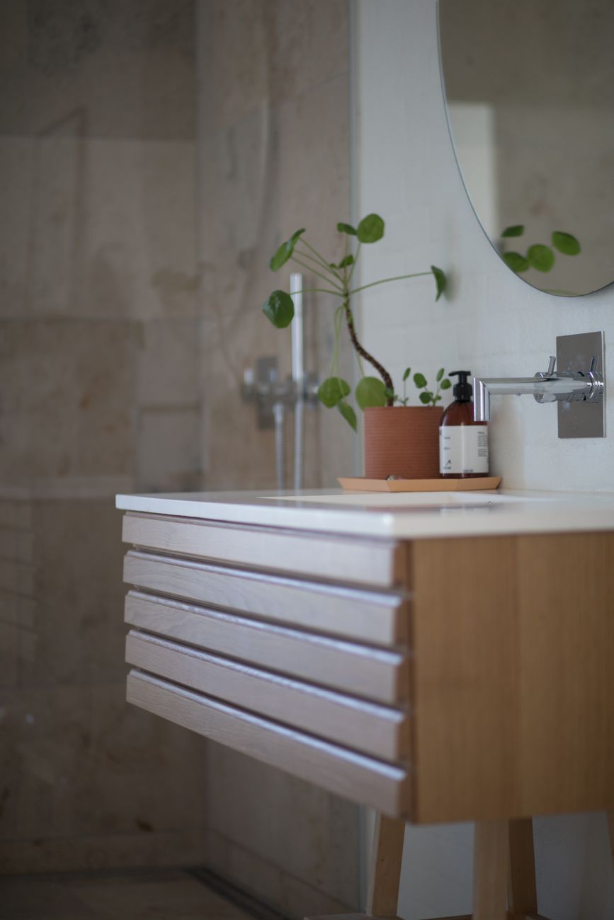 Bathroom interior with freestanding tub and warm natural light