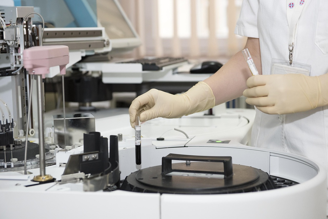 Laboratory test tubes and a clinician at work, signalling public-health attention on menopause care.