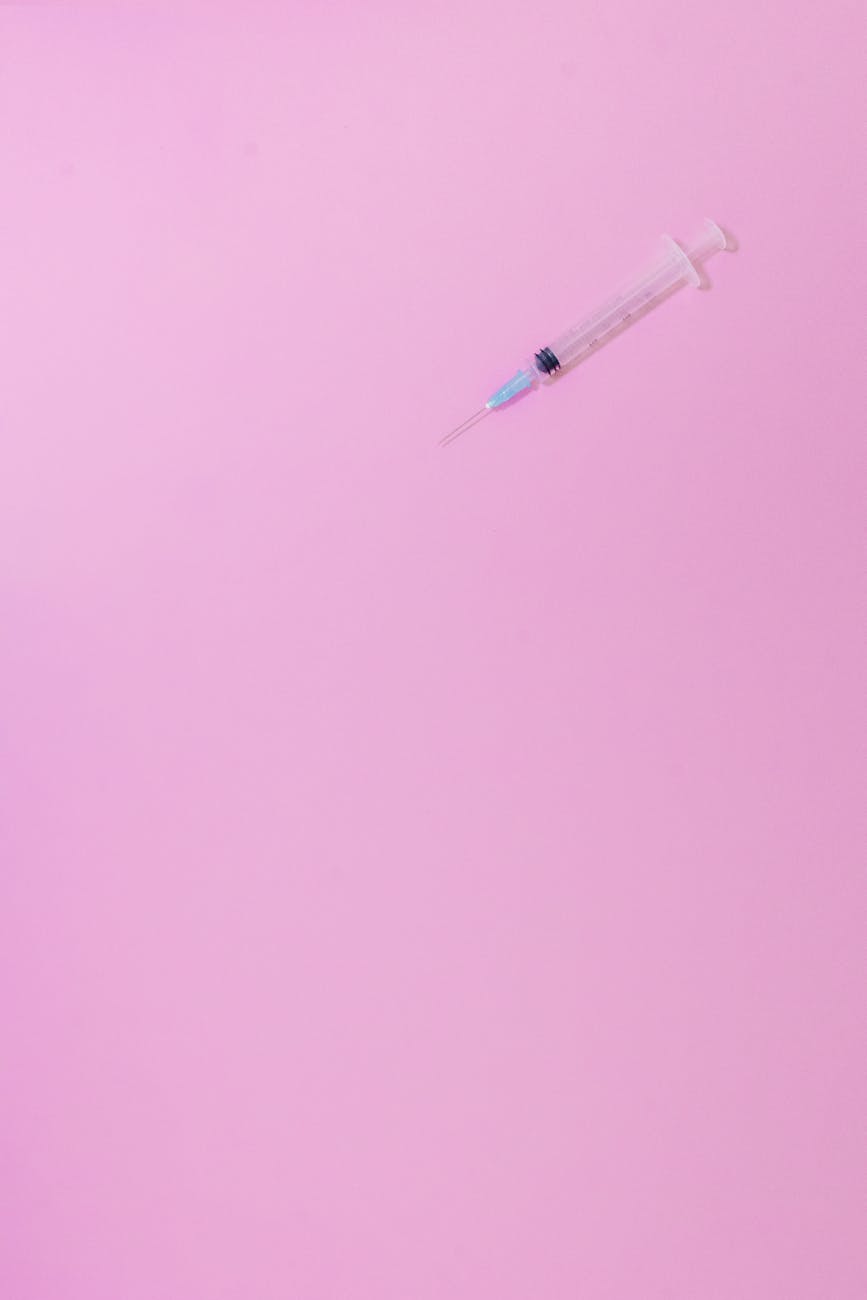 Close-up of injectable cosmetic preparations and medical packaging, representing the blurring line between medical treatment and beauty routine in the injection age