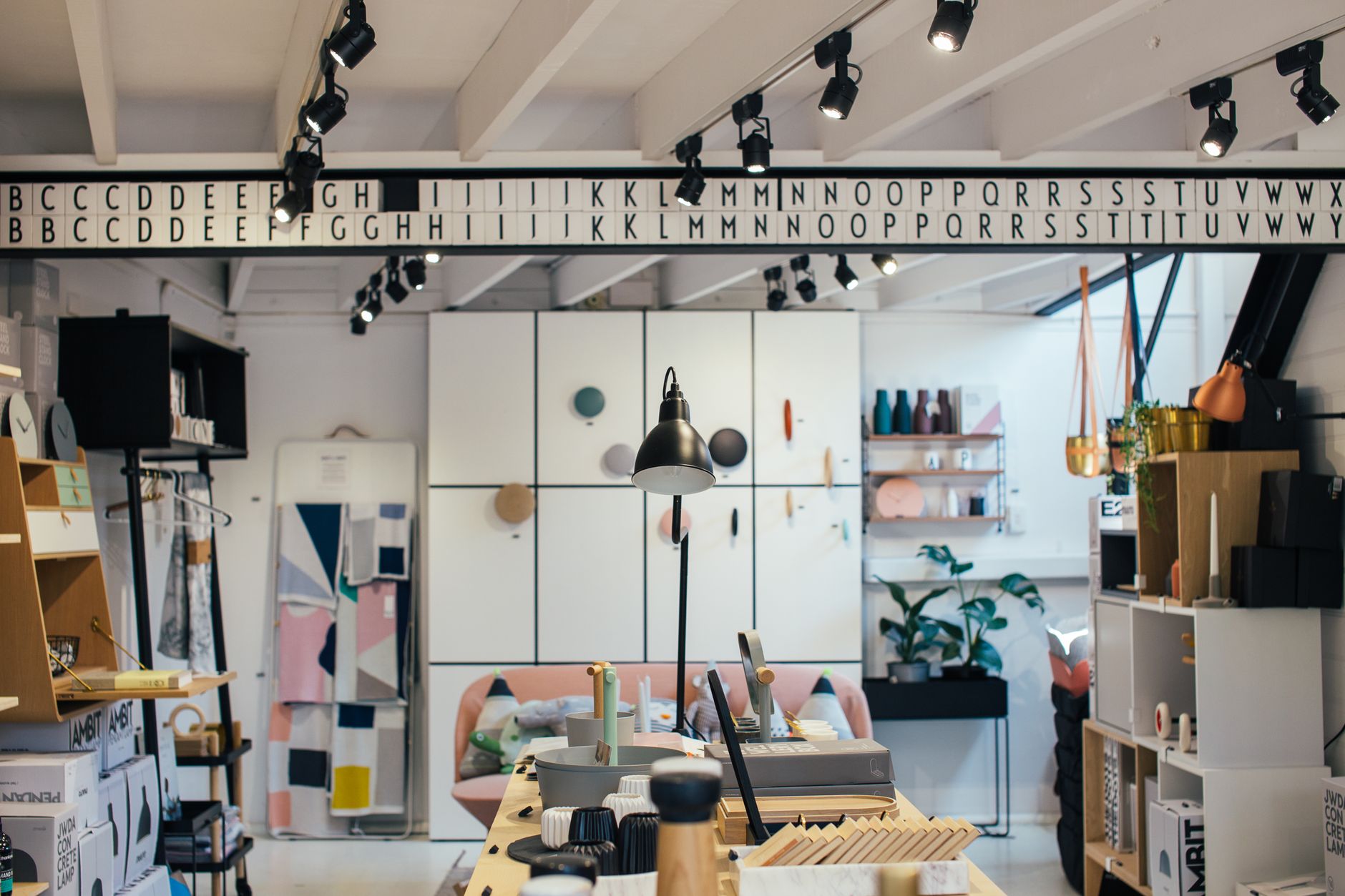 Home goods displayed on wooden shelves inside a decor store