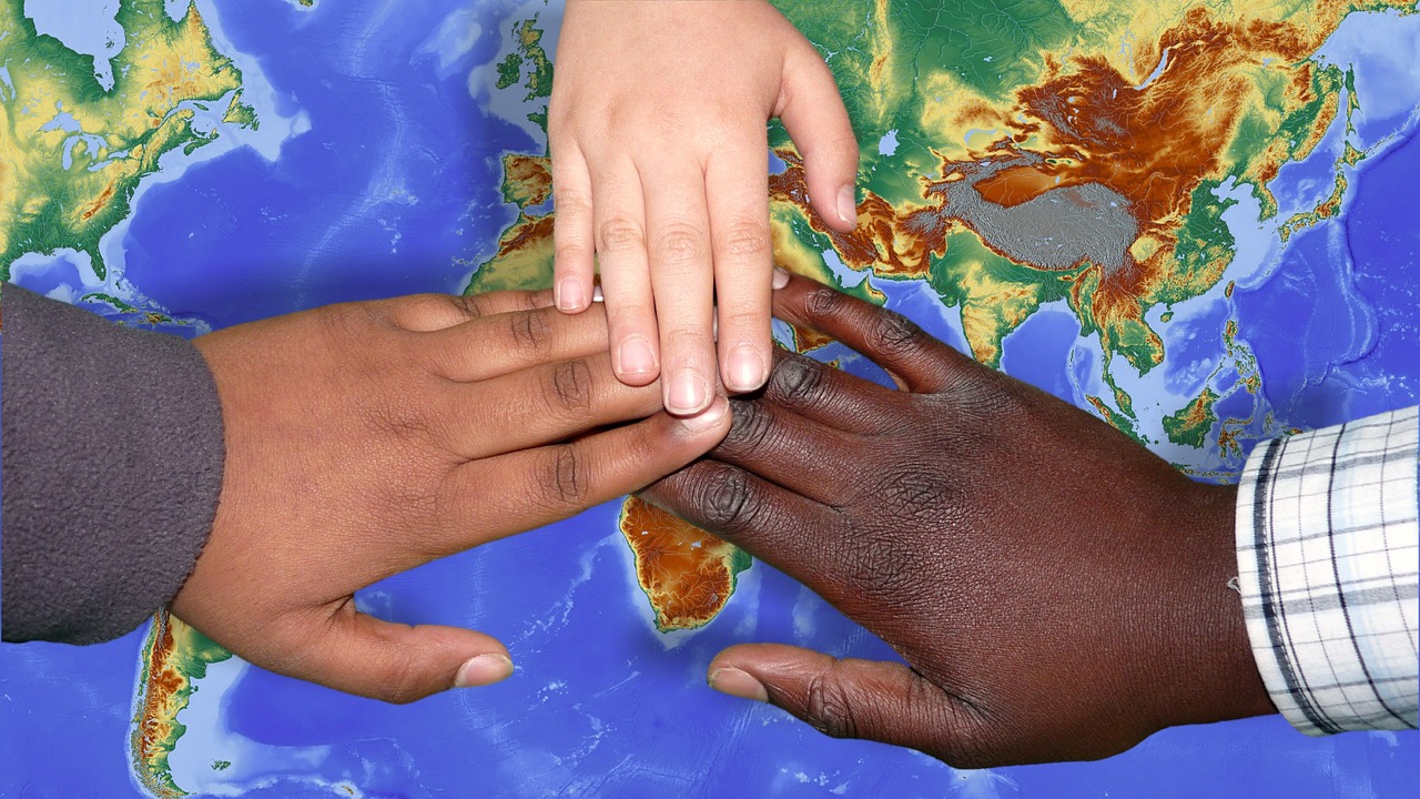 Hands gathered together, suggesting community support and shared recovery