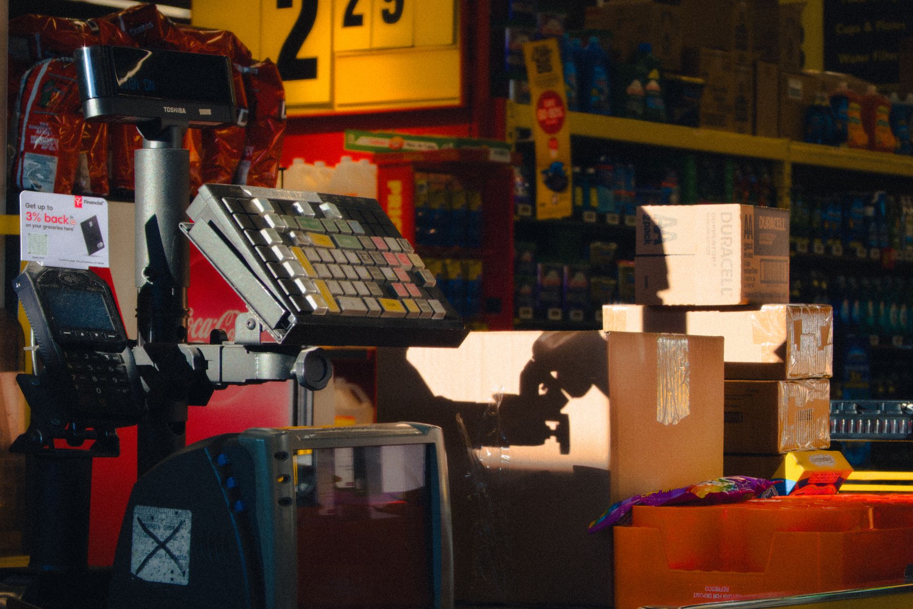 A checkout counter inside a retail store, echoing Kmart's return to front-of-store tills.