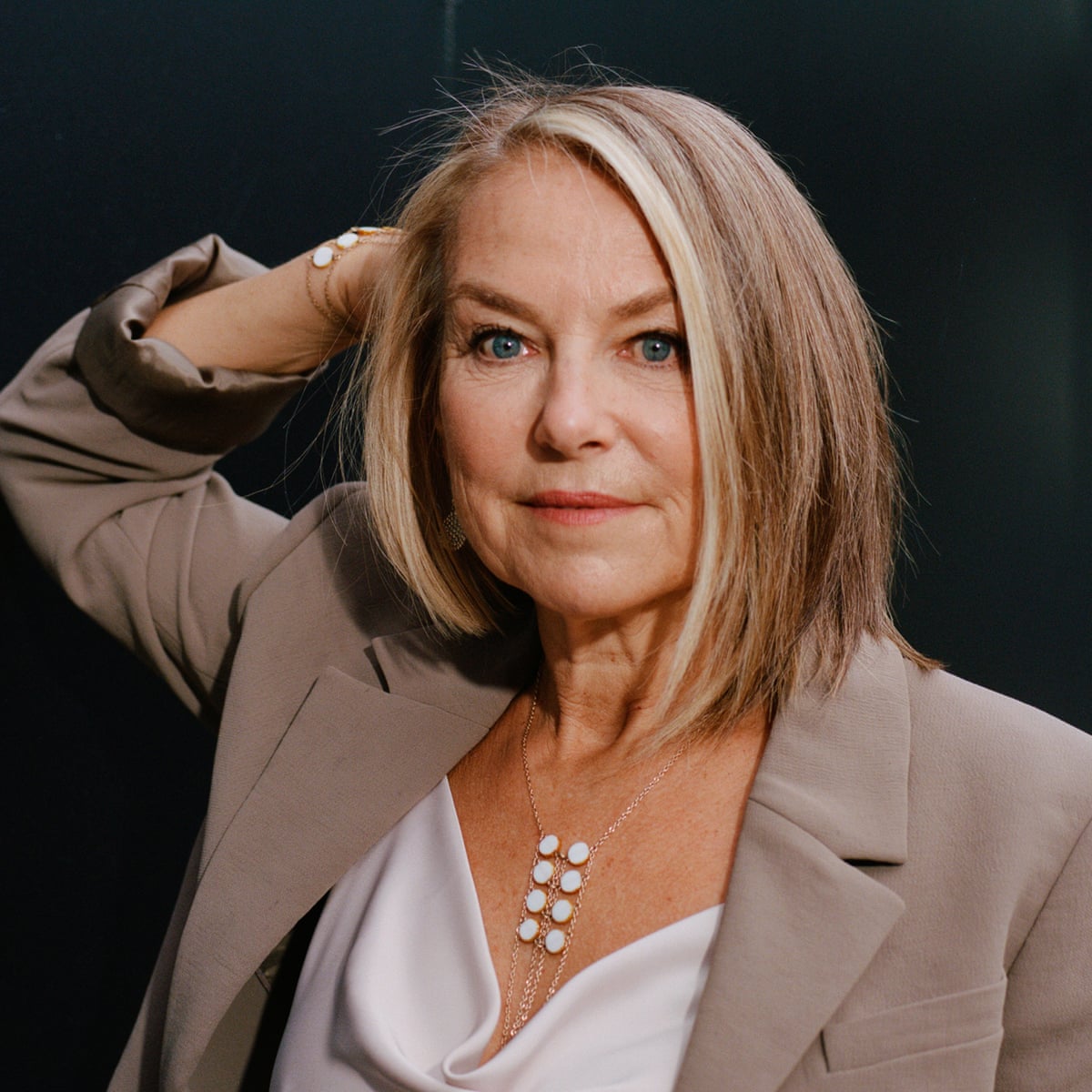Portrait of Esther Perel in a warm studio setting