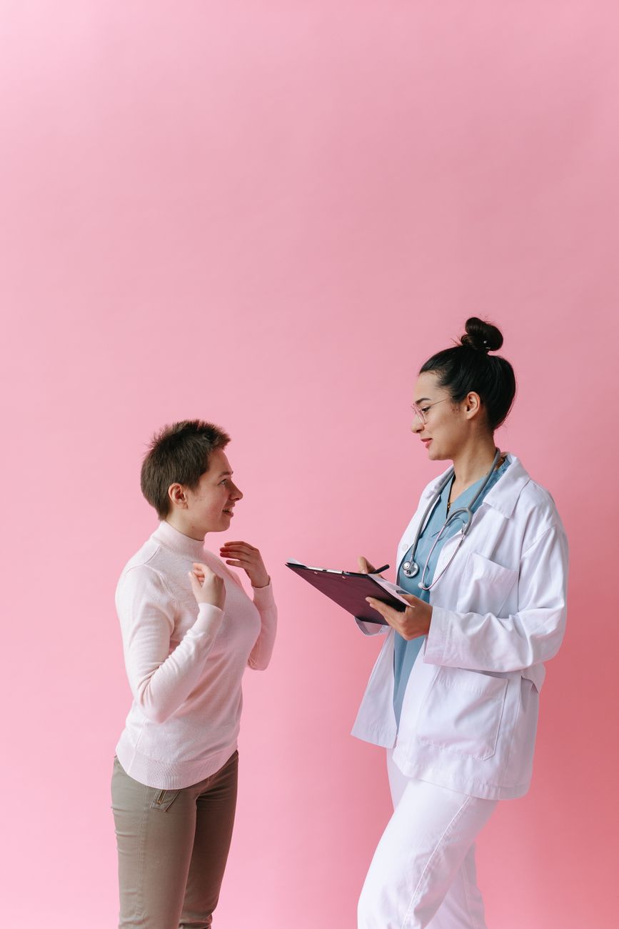 Woman in clinical consultation representing menopause care support